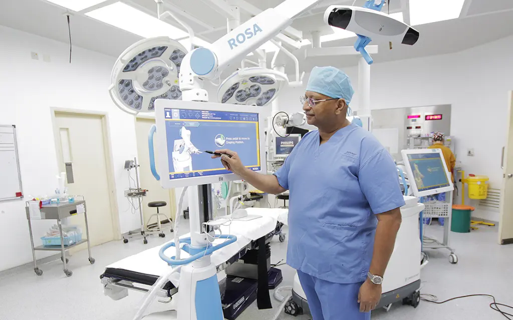 Dr Suhail Surech with Robot